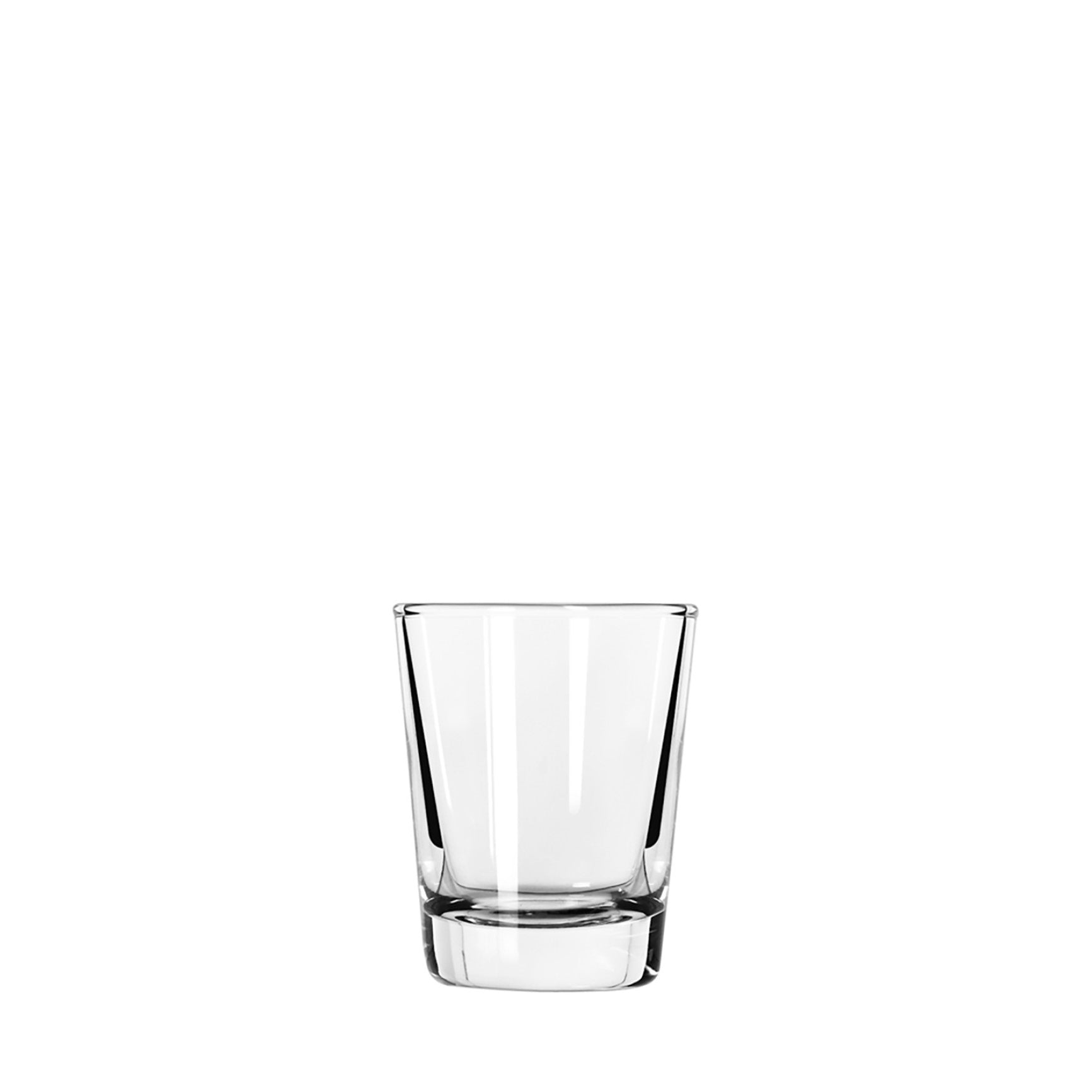 A clear glass whiskey shot glass against a white background.