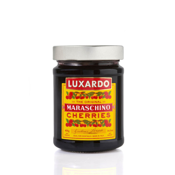 Luxardo Original Maraschino Cherries in a jar on a clear backdrop