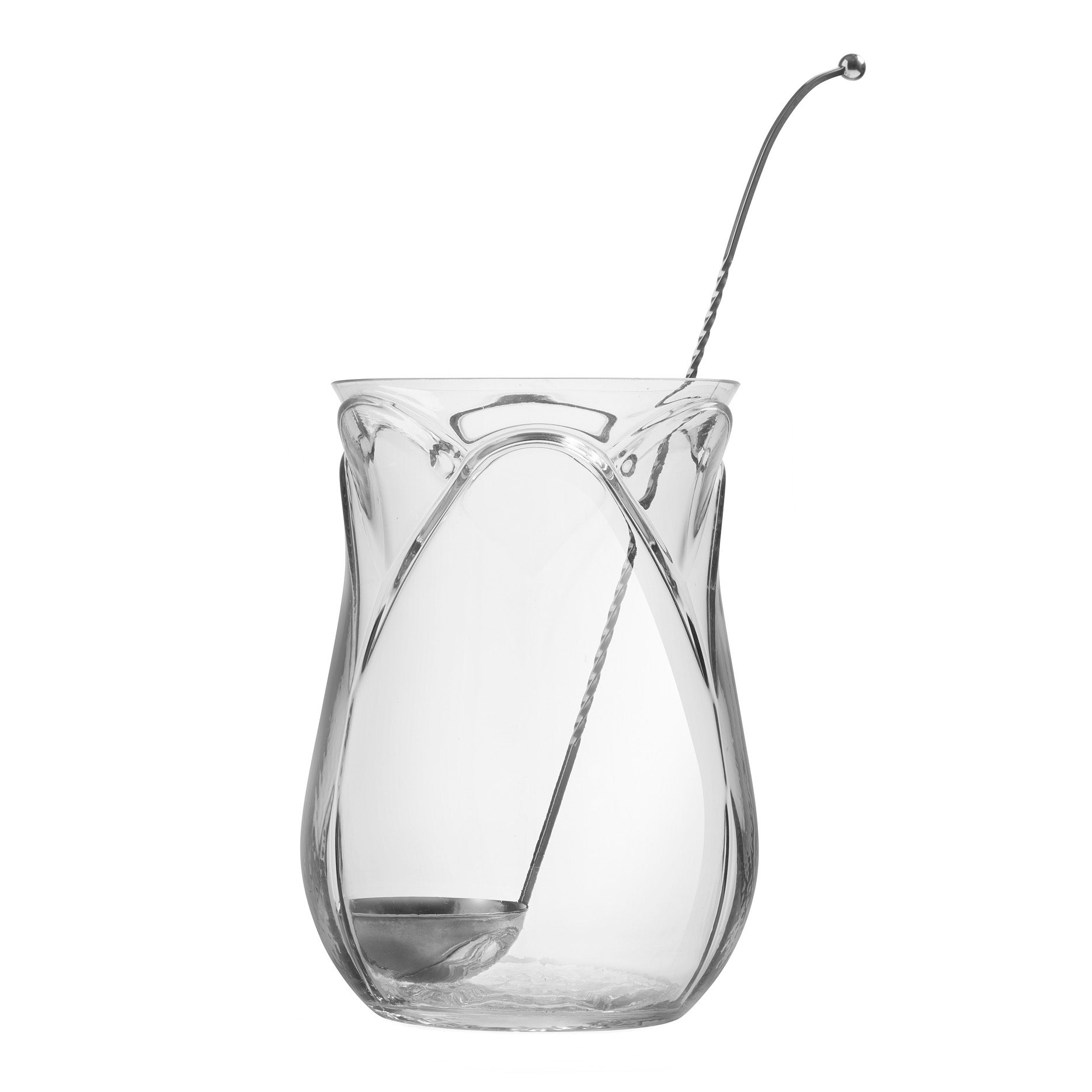 A clear glass tulip-shaped bowl with a spoon placed inside it.